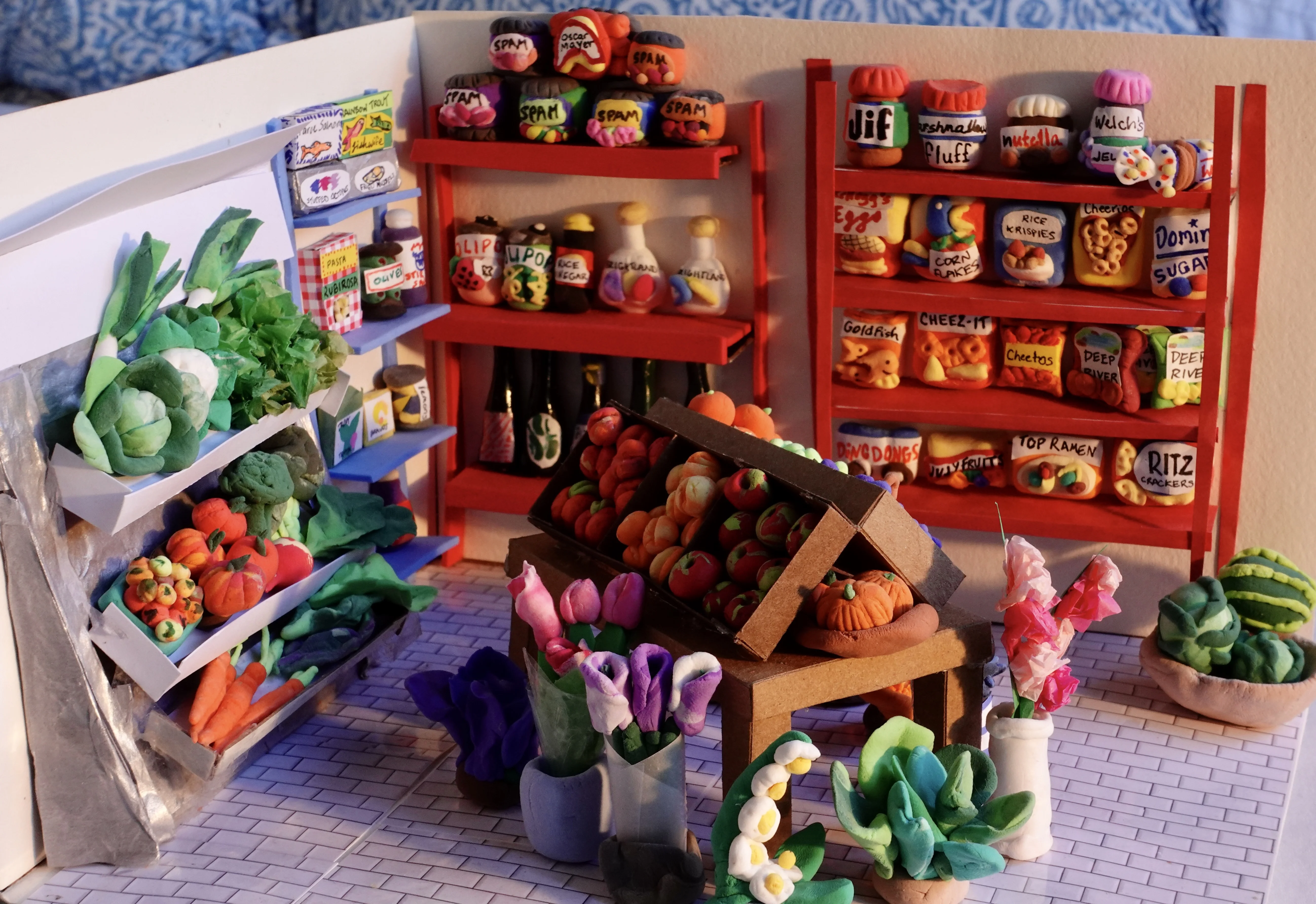 Miniature grocery store sculpture close-up